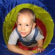 Kid crawls through playspace